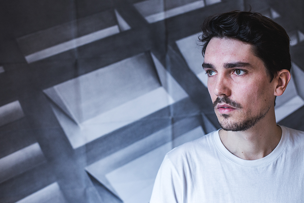 Jean-Baptiste Monnin in front of one of his drawings